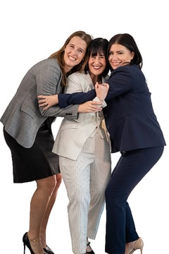 Hollaway owners Leslie, Claire, and Jennifer sharing a group hug