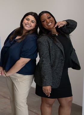 Two Hollaway team members posing back to back