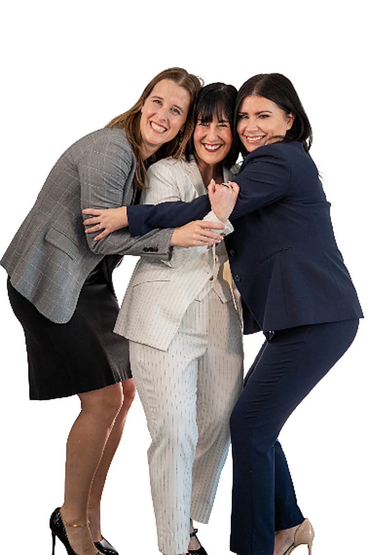 Hollaway owners Leslie, Claire, and Jennifer sharing a group hug