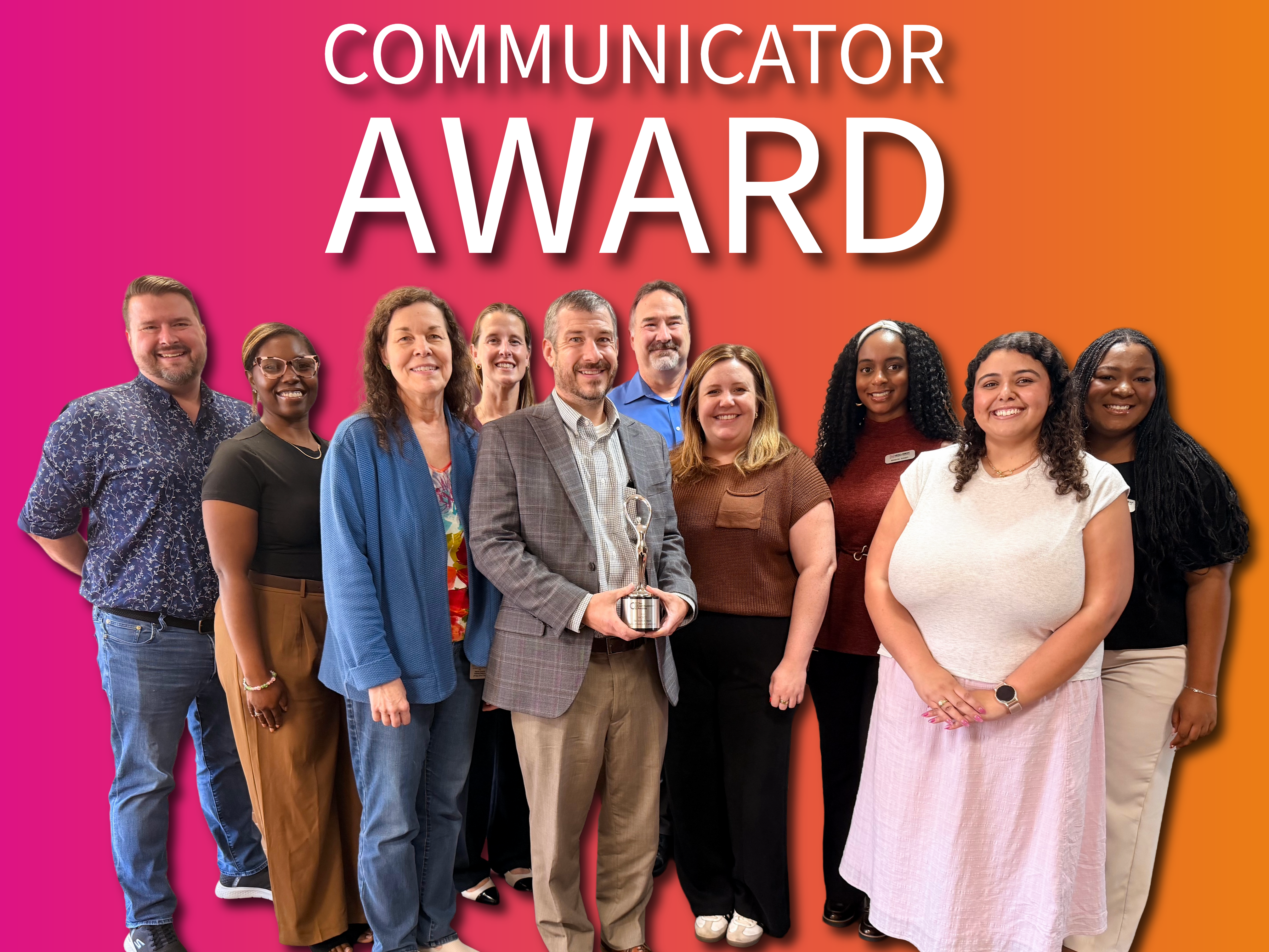 Hollaway team members presenting the Communicator Award trophy to project leads at the Harris County Flood Control District